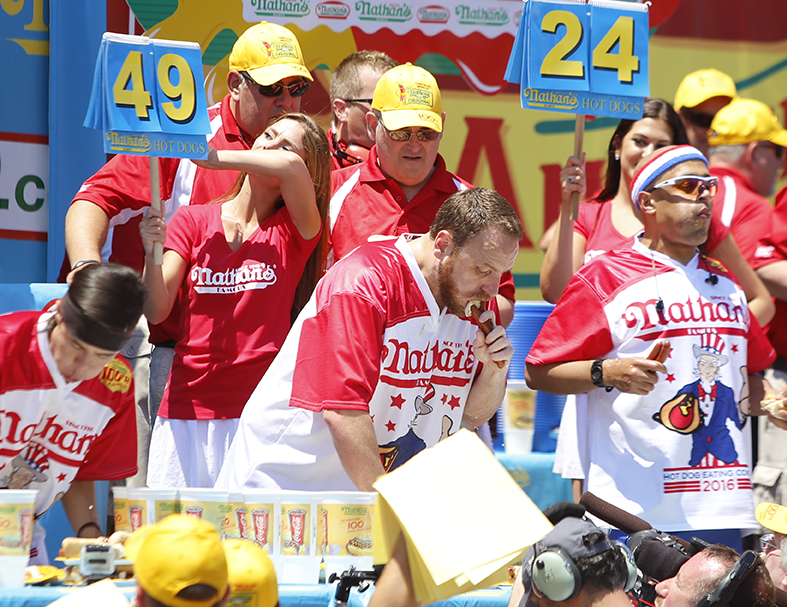 Group of people eating for a contest