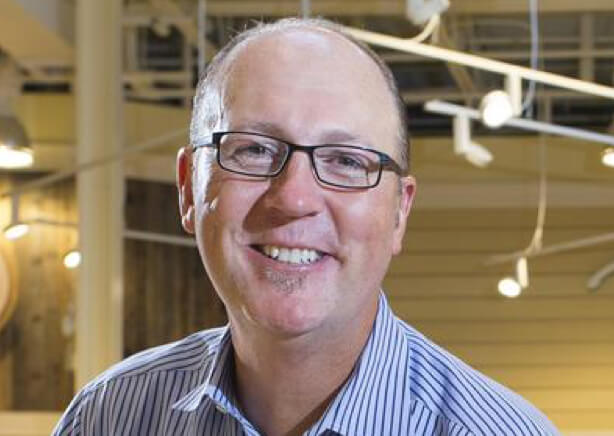 Portrait image of Tim Lowe, President of Lowes Food inside a local store.